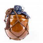 chinese traditional yellow rice wine jar isolated on white.