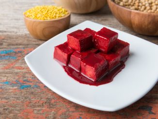 Sufu or Salty red tofu ( tofuyo, choa, ta-huri ) product of soybean on table background
