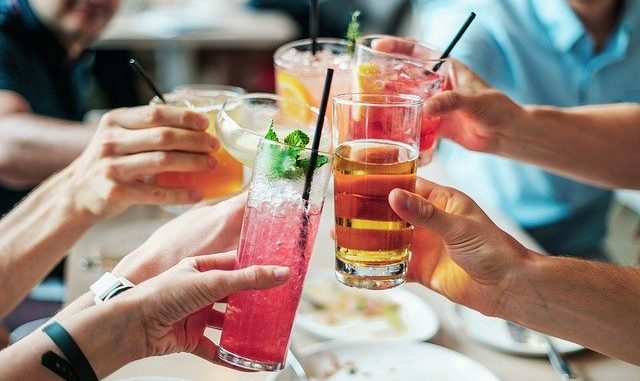 drinks in glasses being clinked. We look at beverage trends for 2020.