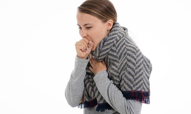 A girl having a cough on a white background. A case for treatment with bakumondoto.