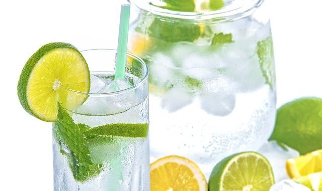 lemon water and lime water in a glass