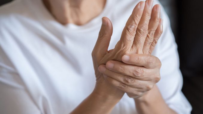 Elderly woman suffering from pain From Rheumatoid Arthritis
