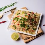 Upma on two white dishes