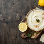 Homemade hummus with thyme, olive oil. Middle Eastern traditional and authentic arab cuisine. Top view, flat lay, overhead