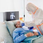 A man in hospital enduring severe infection from COVID 19. Long covid might be a consequence too.