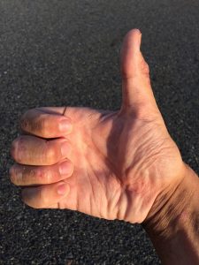 a hand with a thumbs up