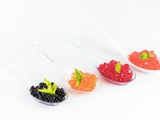 An example of molecular gastronomy. Caviar on four different spoons.