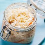 sauerkraut in a glass jar on the table