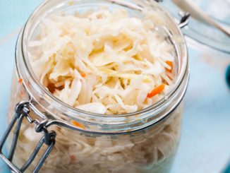 sauerkraut in a glass jar on the table