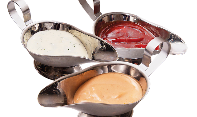 Basic sauces in a sauce boat on a white background.