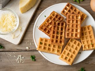 Savory egg and cheese waffles (chaffles) for breakfast. Keto (ketogenic) recipe - morning protein waffles, close up.