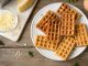 Savory egg and cheese waffles (chaffles) for breakfast. Keto (ketogenic) recipe - morning protein waffles, close up.
