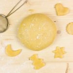 short crust pastry on wood background - top view,