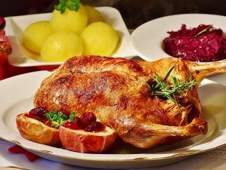 roast duck served with sides and garnishes