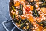 Soup with vegetables, beans, kale, top view.Typical tuscan bean soup, ribollita.