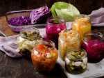 Pickled vegetables in jars. Vegetarian food concept.