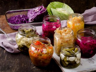 Pickled vegetables in jars. Vegetarian food concept.