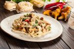 Tagliatelle pasta with chicken and chanterelles mushrooms with creamy sauce