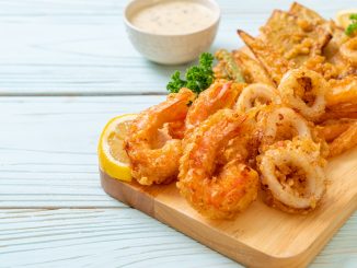 Tempura squid with tempura prawns on a fried fish board.