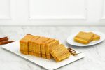 Lapis Legit, Indonesian Traditional Layered Cake on White Table, Copy Space