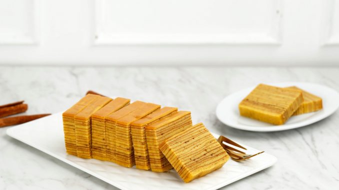 Lapis Legit, Indonesian Traditional Layered Cake on White Table, Copy Space