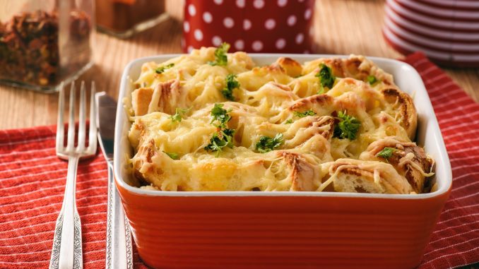Bread casserole with chicken, spinach, eggs and cheese known as strata.