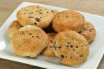 eccles cakes on a white dish.
