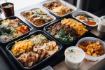 food delivery service with variety of freshly cooked meals for busy people, created with generative ai. Gourmet ready meals.