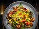 Tagliatelle pasta with tomatoes, sun-dried tomatoes, olives and dill