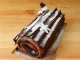 Delectable Buche de Noel or Chocolate Yule Log Cake for Christmas Sprinkle with Icing Sugar on the Wooden Table