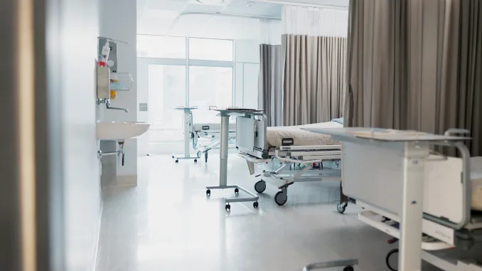 Hospital, modern and interior of bedroom or empty room for healthcare, consulting or healing. Background, medical and clinic space for emergency, rehabilitation or recovery with furniture or light, Niemann-Pick Disease