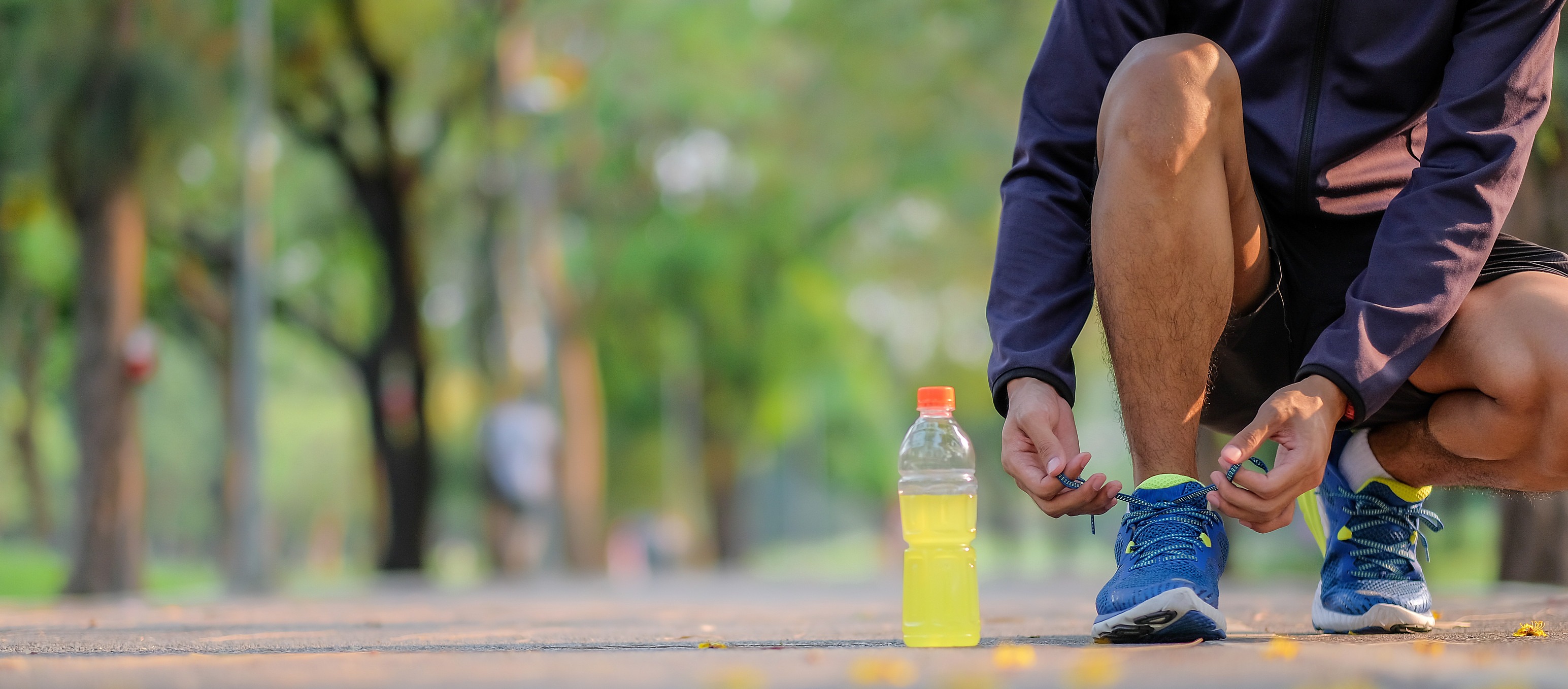 man tying shoelaces, sports drink, osmolarity and osmolality are important quality measures.
