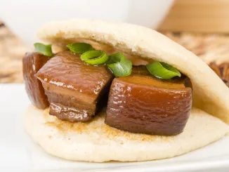 Hong Shao Rou Red Cooked Pork - Pork belly caramelized and braised in soy sauce with star anise, cinnamon inside a steamed bun he ye bao