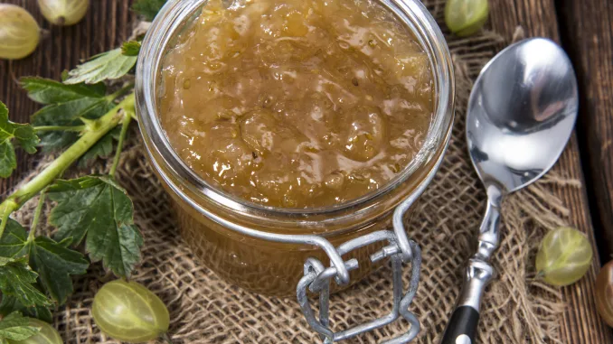 Fresh made Gooseberry Jam on vintage wooden background