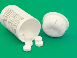 Pill Medicine and Bottle on green background. Nitazines