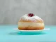 Tradition Jewish holiday sweets, donut sufganiyot with sugar powder and jam.
