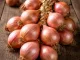 Roscoff onions on a wooden board