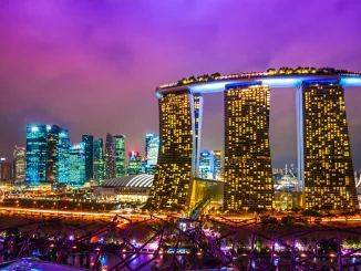Fish-eye view of Singapore city skyline at sunset.