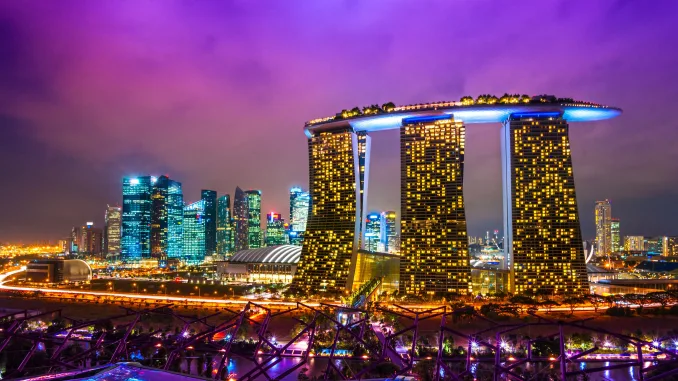 Fish-eye view of Singapore city skyline at sunset.